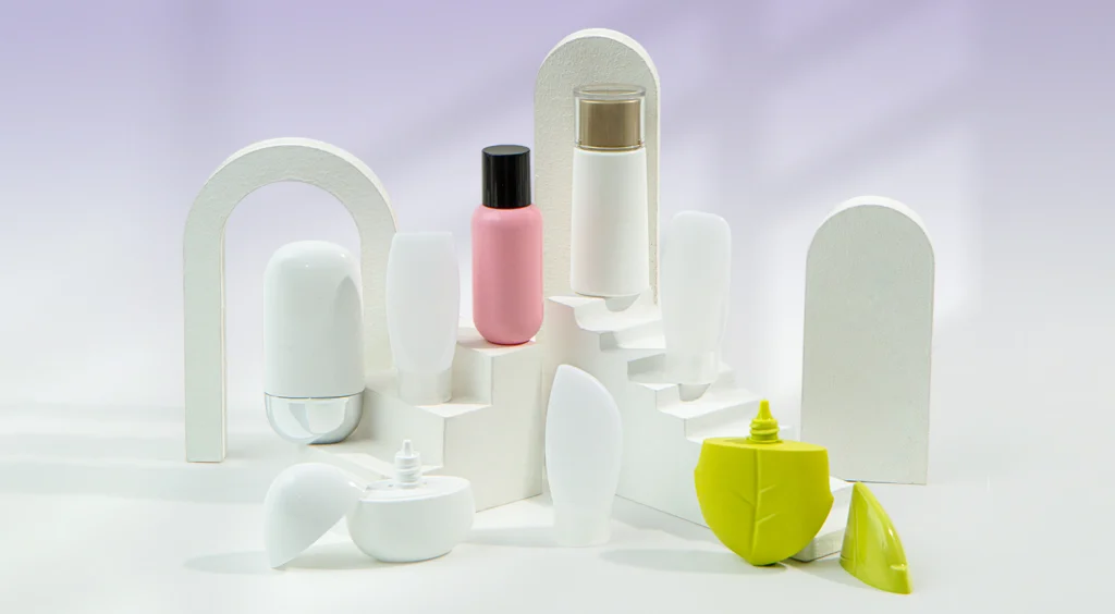 White sculptural display holding a pink bottle of cosmetic product, surrounded by white containers on a pale lavender background.